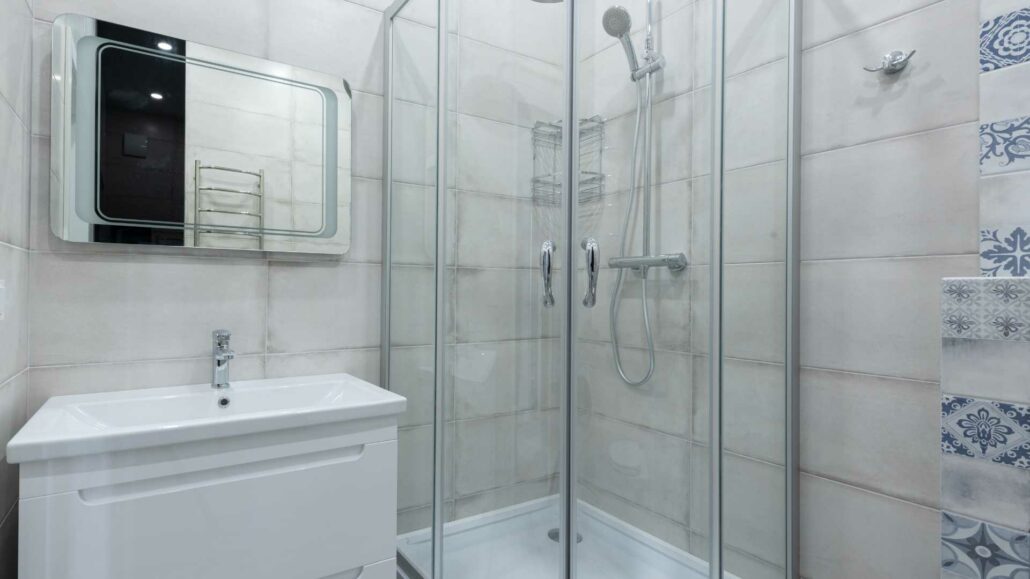 corner shower doors with framed glass enclosure